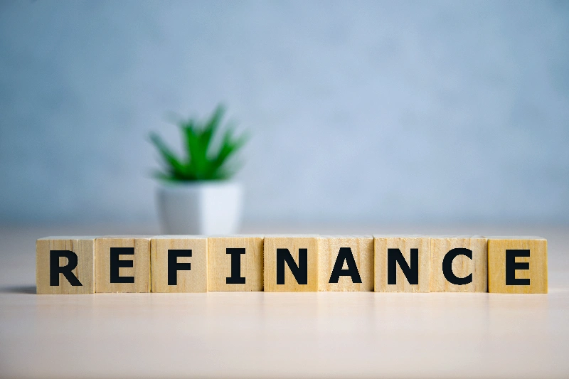 Focus on wooden letter Refinance
